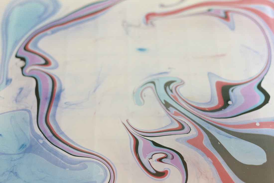 Marbling Inks on the surface of the size